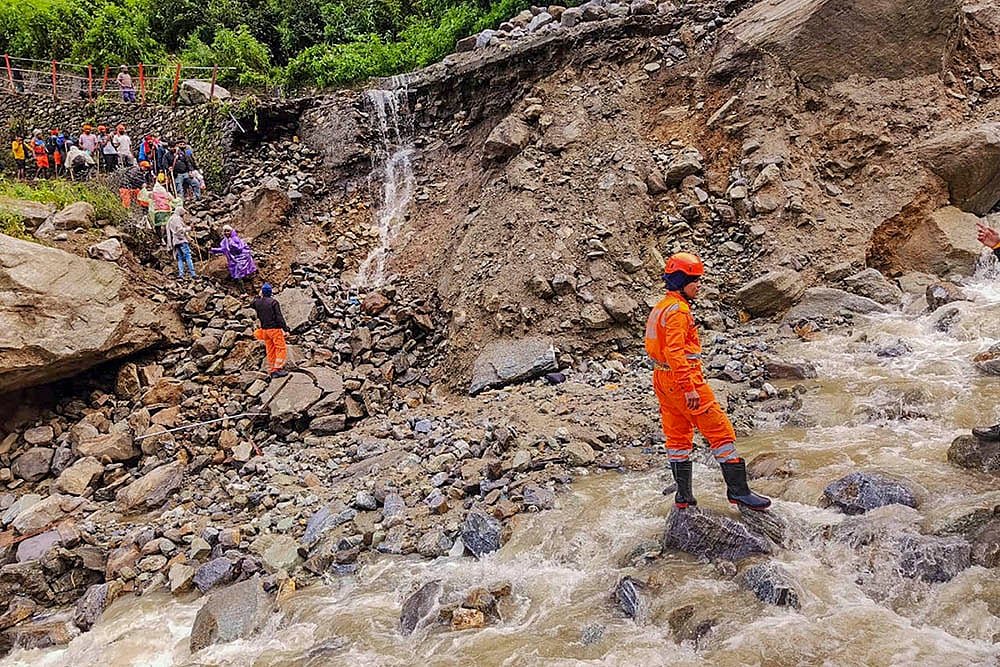| Photo: PTI : Cloudburst at Junglechatti near Lincholi